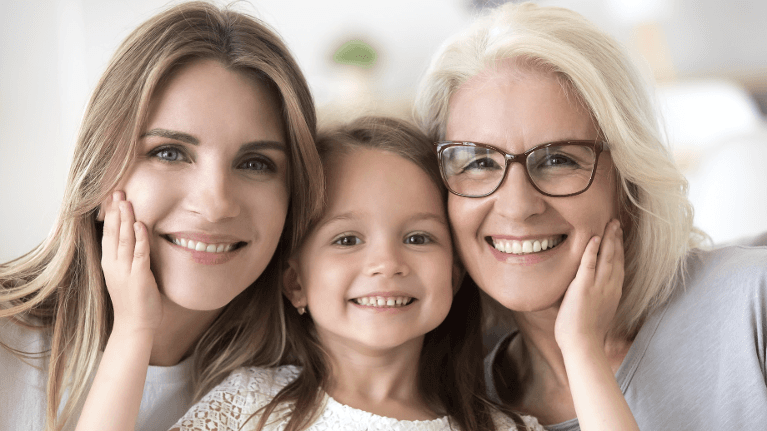 mother, daughter, and grandmother smiling in schaumburg 