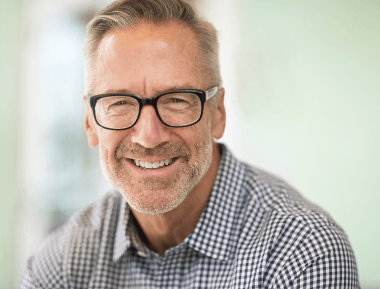 schaumburg man with glasses smiling 
