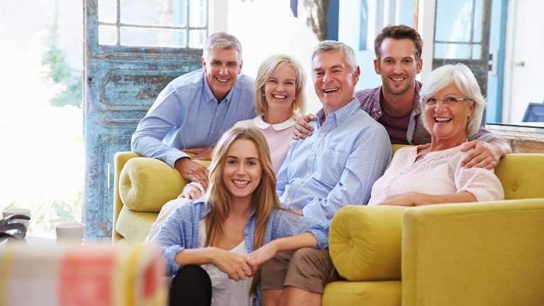 multigenerational family sitting on the couch