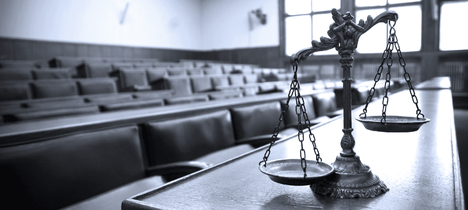scales of justice sitting on a desk