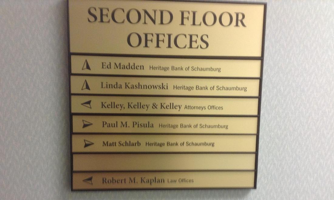 Front office sign showing office location